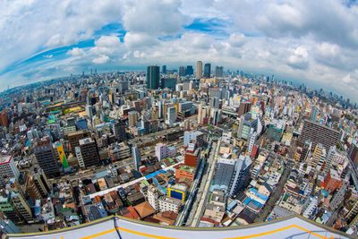 High angle view of modern buildings in city against sky