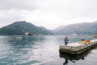 Rear view of man kayaking in lake