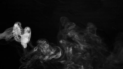 Close-up of smoke against black background