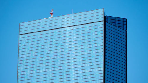 Low angle view of building against clear blue sky