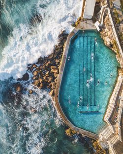 High angle view of swimming pool by sea