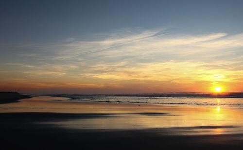 Scenic view of sea against sky at sunset