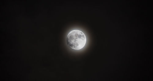 Low angle view of moon against sky at night