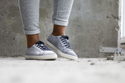 Low section of woman walking on floor