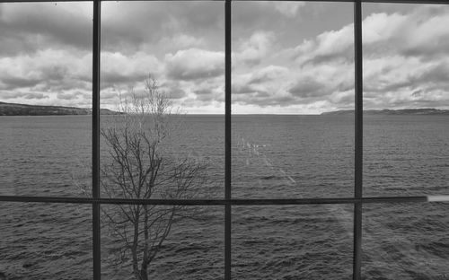 Scenic view of sea seen through window