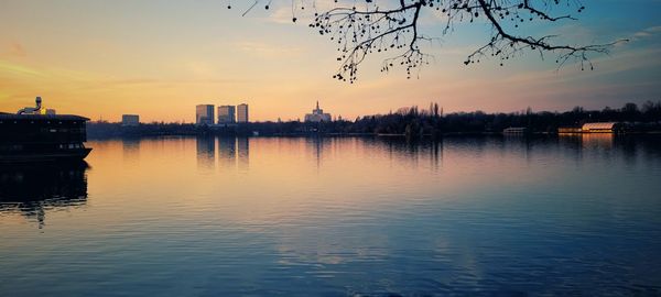 Scenic view of lake against sky during sunset