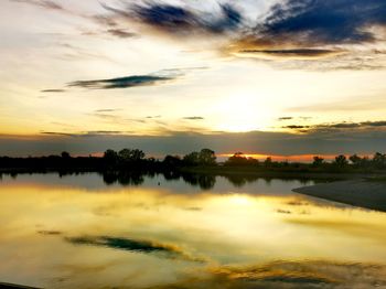 Scenic view of lake against sky during sunset