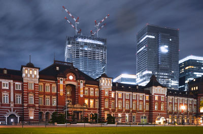 Buildings in city at night