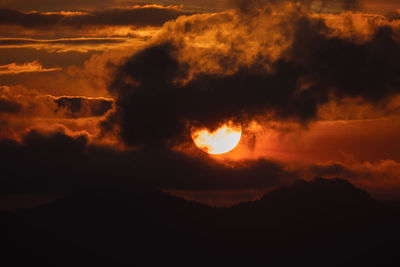 Scenic view of dramatic sky during sunset