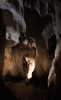 Man standing in cave