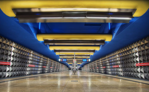 Interior of illuminated subway station platform
