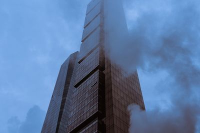 Low angle view of modern building against sky