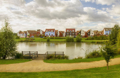 Houses in town against sky