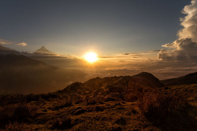 Scenic view of mountains against sky during sunset