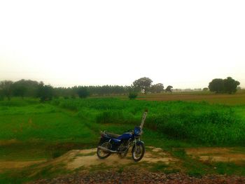 Bicycle parked on field