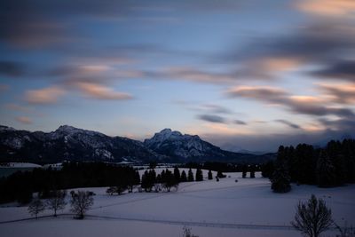 Scenic view of mountains against sky during winter