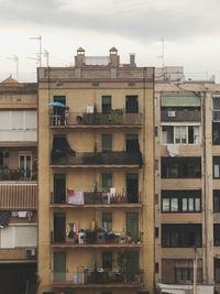 Low angle view of buildings in city against sky