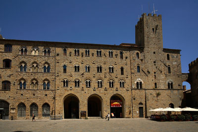 Facade of historic building against clear sky