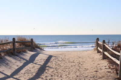 Scenic view of beach against clear sky