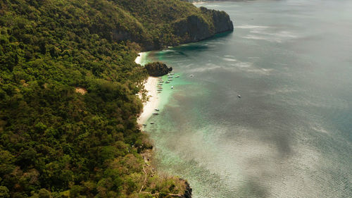Sandy beach, aerial view. el nido, philippines, palawan. seascape with tropical rocky islands,