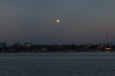 Scenic view of sea against clear sky at night