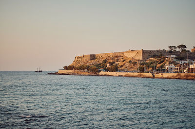 Scenic view of sea against clear sky during sunset