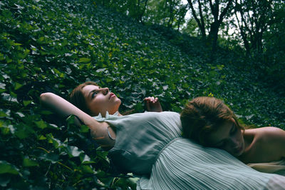 Woman lying on grass