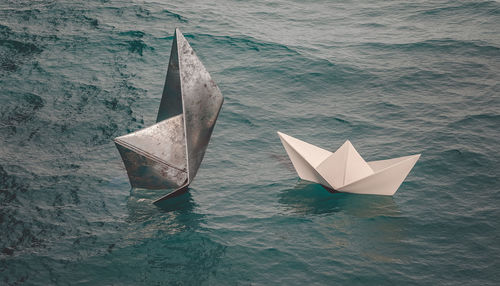 High angle view of sailboat floating on sea