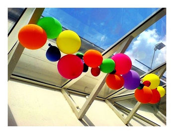 Low angle view of multi colored balloons