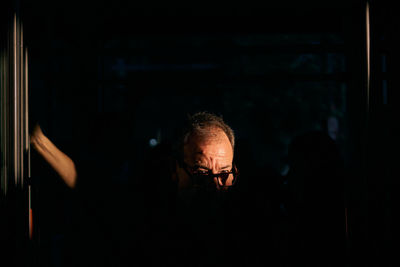 Full length portrait of man at night