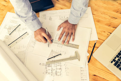 High angle view of man working on table