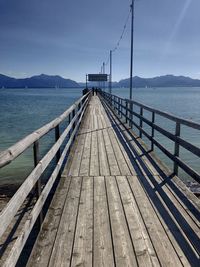 Pier over sea against sky