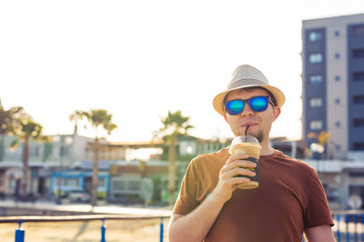 Young woman holding ice cream cone