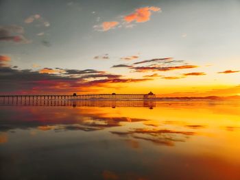 Scenic view of sea against sky during sunset with reflection