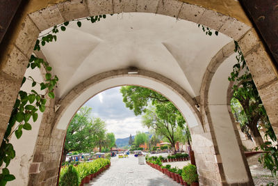 Archway of historic building against sky