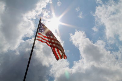 Low angle view of flag against sky