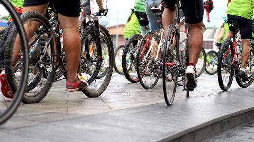 Low section of people on bicycle