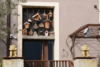 A lot of birdhouses outside a building in morcote, canton ticino, switzerland.