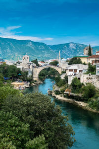 View of bridge over river against blue sky