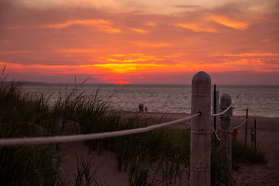 Scenic view of sea against orange sky