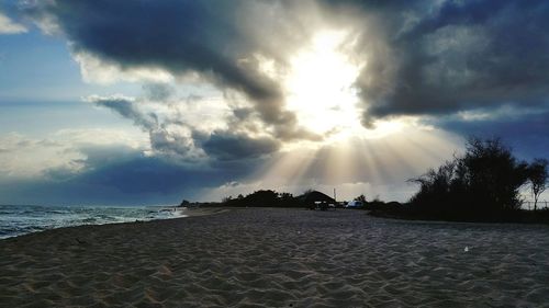 Scenic view of sea against cloudy sky