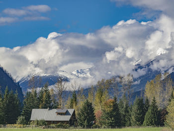 Panoramic view of trees and mountains against sky