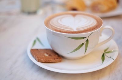 Close-up of cappuccino on table