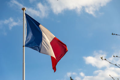 Low angle view of flag against sky