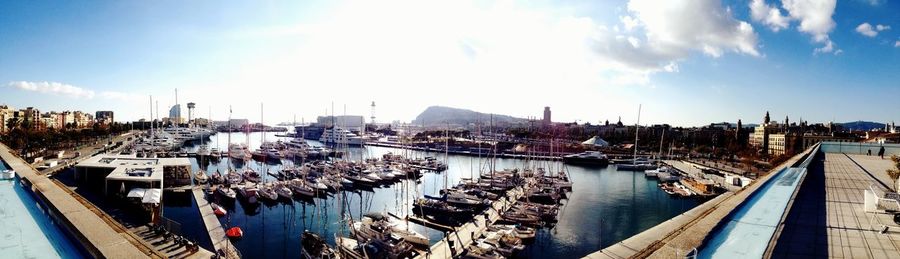 Boats in river with buildings in background
