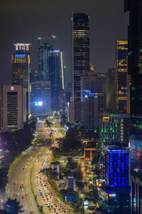 Aerial view of illuminated buildings in city at night