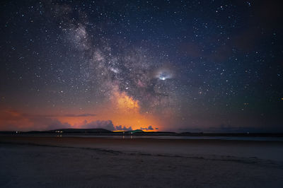 Scenic view of sea against sky at night