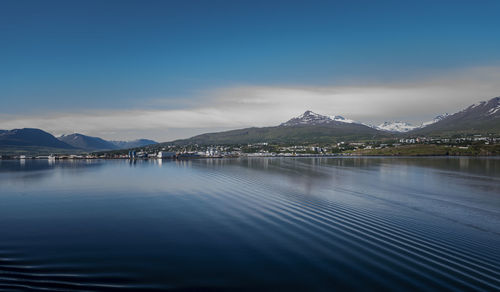 Scenic view of lake against blue sky