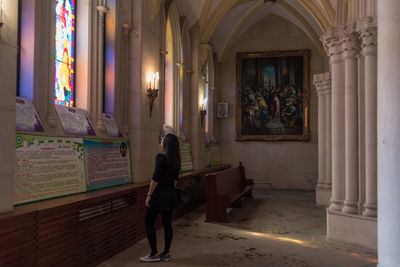 Woman in corridor of building