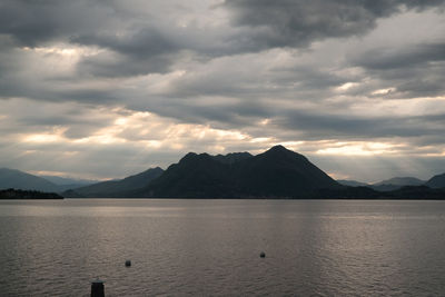 Scenic view of mountains against cloudy sky